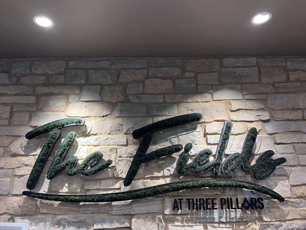 Moss wall in office logo