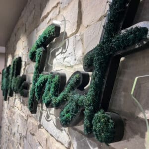 Moss wall in office logo