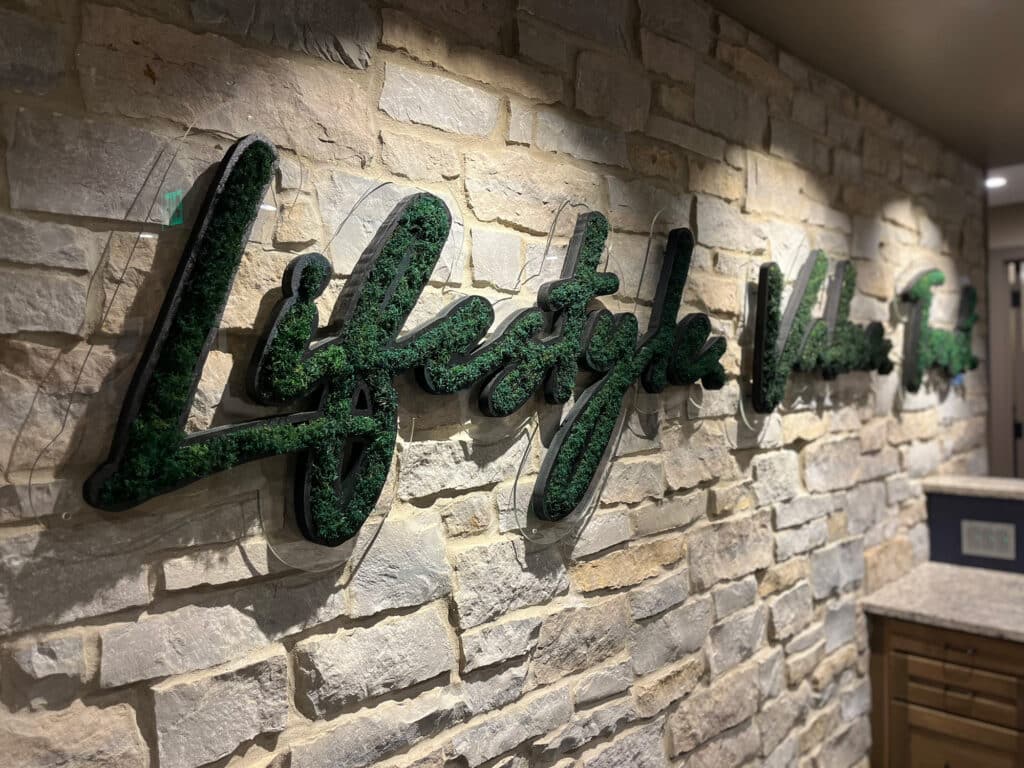 Moss wall in office logo