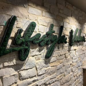 Moss wall in office logo